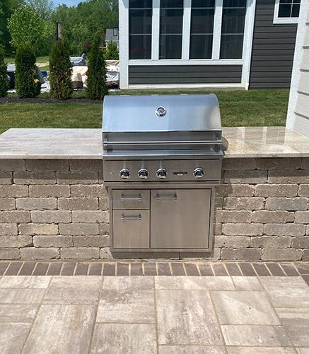 Outdoor kitchen with grill and granite counter top