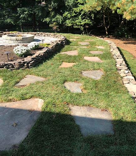 Stepping stone pathway through grass