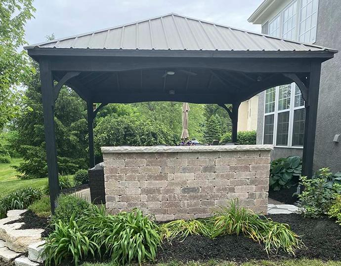 Black pavilion in backyard