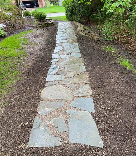 Natural stone walkway from patio