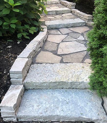 Natural stone patio walkway with patio steps
