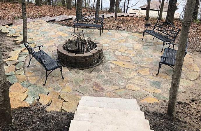 Natural stone patio and fire pit installation