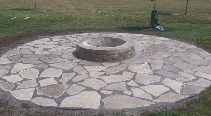 Flagstone patio and fire pit area install
