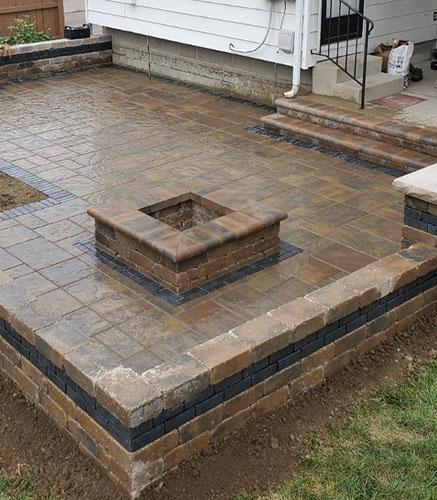 Paver fire pit installation in patio
